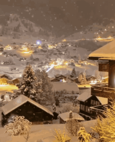 A Snowy Landscape With A House In The Foreground That Says ' A ' On It GIF