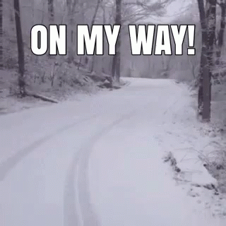 A Snowy Road In The Woods With The Words On My Way GIF