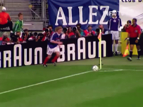 A Soccer Field With A Banner That Says Allez Braun GIF