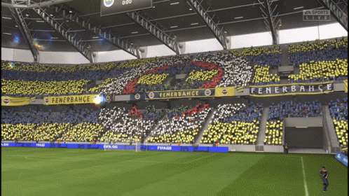 A Soccer Field With A Banner That Says Fenerbahce GIF