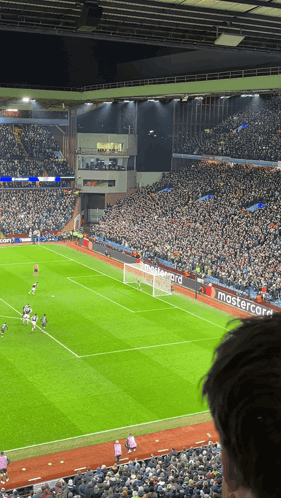 A Soccer Field With A Mastercard Banner On The Side GIF