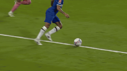 A Soccer Field With Emirates Fly Better Signs GIF