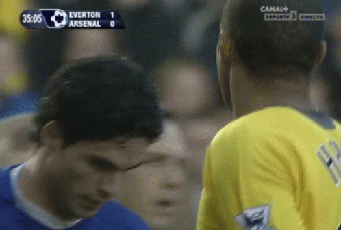 A Soccer Game Between Everton And Arsenal Is Being Played On Canal + GIF