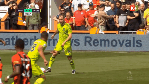 a soccer game is being played and the score is 0-1