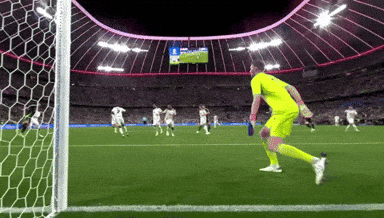 A Soccer Game Is Being Played In A Stadium And The Goalie Is Wearing A Yellow Uniform GIF