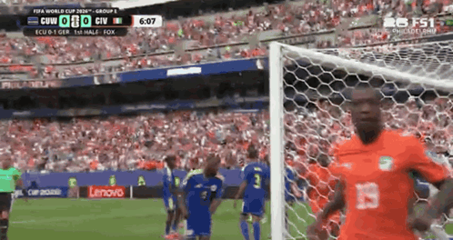a soccer game is being played in a stadium and the score is 0-0