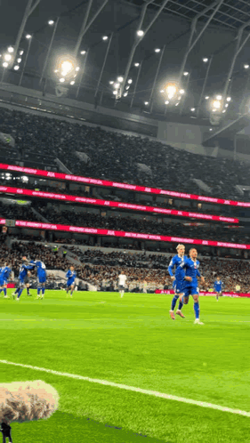 A Soccer Game Is Being Played In A Stadium That Says ' Manchester United ' On The Side GIF