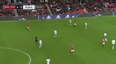 a soccer game is being played in a stadium