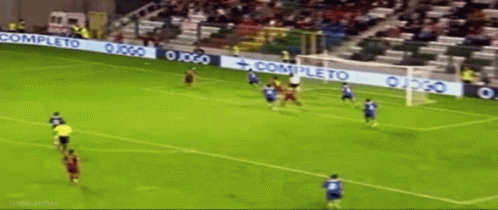 A Soccer Game Is Being Played In A Stadium With A Banner That Says Completo GIF