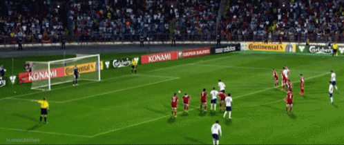 A Soccer Game Is Being Played In A Stadium With Advertisements For Konami And Adidas GIF