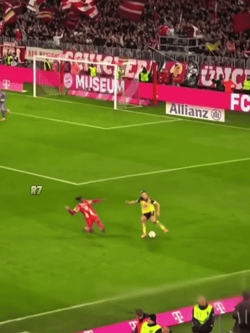 A Soccer Game Is Being Played In Front Of A Banner For Fc Bayer GIF