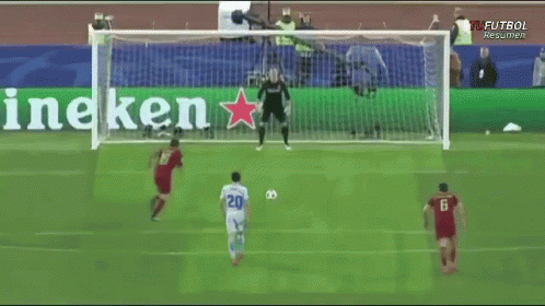 A Soccer Game Is Being Played In Front Of A Banner That Says Heineken GIF