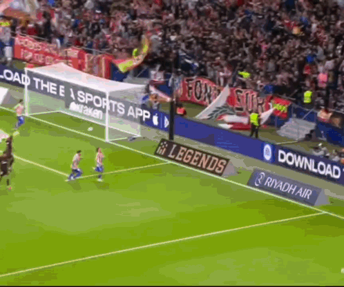 A Soccer Game Is Being Played In Front Of A Banner That Says Legends GIF