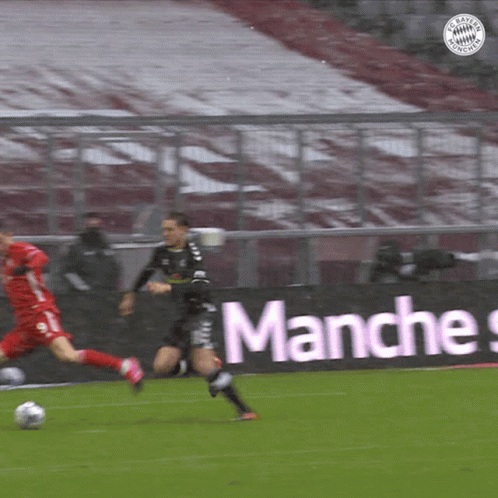 A Soccer Game Is Being Played In Front Of A Banner That Says " Manches " GIF