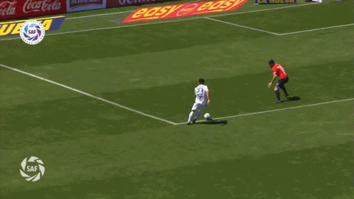 a soccer game is being played in front of a banner that says pandilla toyota