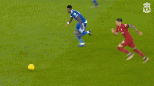 A Soccer Game Is Being Played In Front Of A Coca-Cola Advertisement GIF