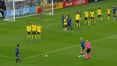 A Soccer Game Is Being Played In Front Of A Continental Ad GIF