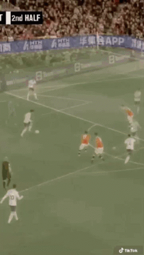 A Soccer Game Is Being Played In Front Of A Crowd With A Banner That Says App On It GIF