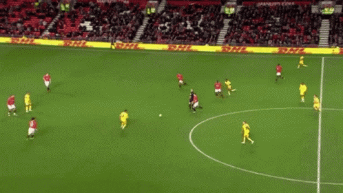 A Soccer Game Is Being Played In Front Of A Crowd With A Sign That Says ' Allianz ' On It GIF