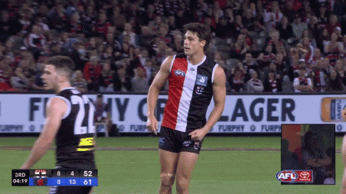A Soccer Game Is Being Played In Front Of A Large Banner That Says Furphy Lager GIF