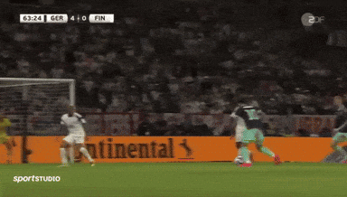 A Soccer Game Is Being Played In Front Of A Large Continental Ad GIF