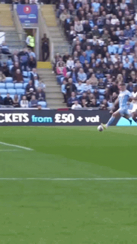 A Soccer Game Is Being Played In Front Of A Large Sign That Says ' Large Tickets ' GIF