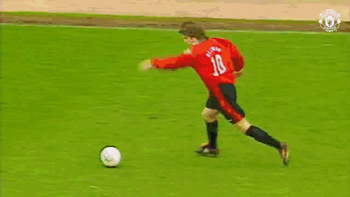A Soccer Game Is Being Played In Front Of A Mcdonald 'S Ad GIF