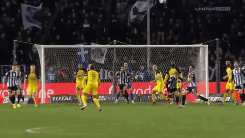 A Soccer Game Is Being Played In Front Of A Nova Sports Sign GIF