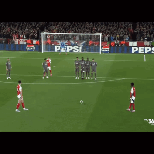 A Soccer Game Is Being Played In Front Of A Pepsi Ad GIF