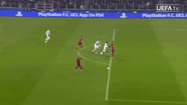 a soccer game is being played in front of a playstation advertisement