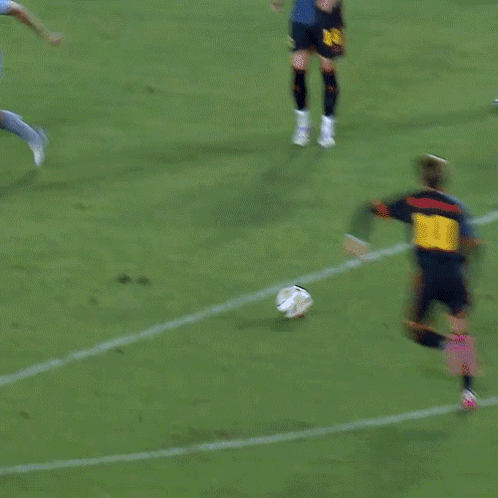 A Soccer Game Is Being Played In Front Of A Sign For Adidas GIF