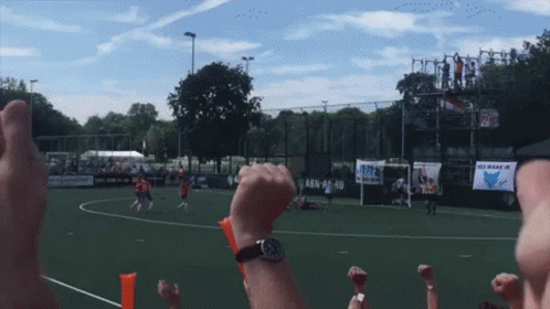 A Soccer Game Is Being Played In Front Of A Sign That Says Abn 24-10 GIF