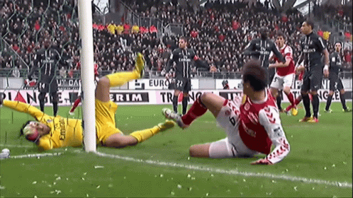A Soccer Game Is Being Played In Front Of A Sign That Says Emirates GIF
