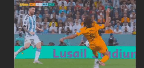 A Soccer Game Is Being Played In Front Of A Sign That Says Lusail Stadium GIF