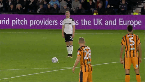 A Soccer Game Is Being Played In Front Of A Sign That Says ' Pitch Providers Across The Uk And Europe ' GIF