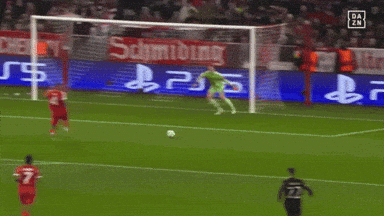 a soccer game is being played in front of a sign that says schmidting