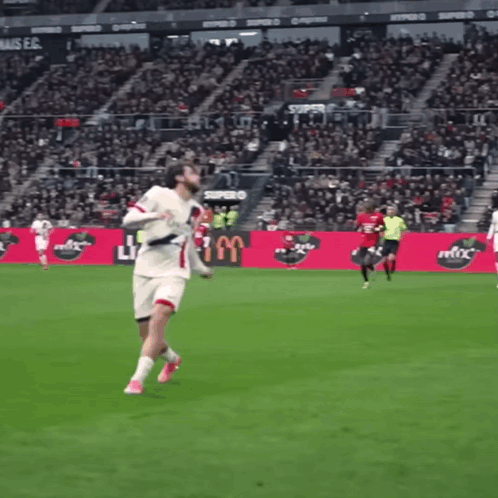 A Soccer Game Is Being Played In Front Of A Sign That Says Supra GIF