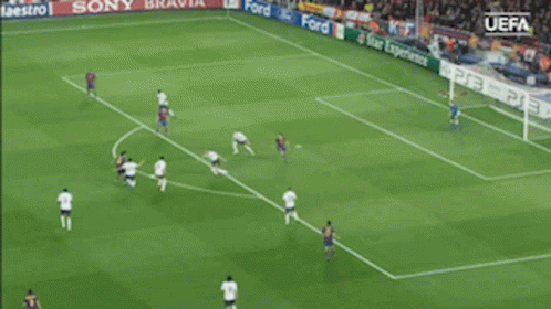 A Soccer Game Is Being Played In Front Of A Uefa Banner GIF