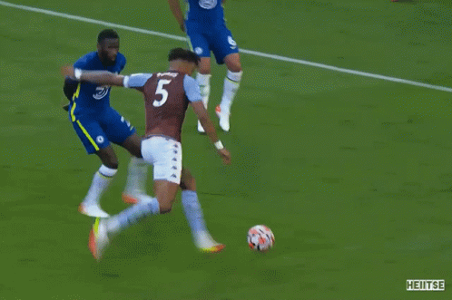 A Soccer Game Is Being Played In Front Of A Yokohama Ad GIF