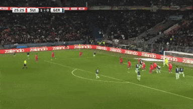 a soccer game is being played in front of a zalando advertisement
