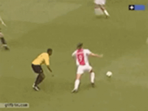 a soccer game is being played in front of an ad for energie