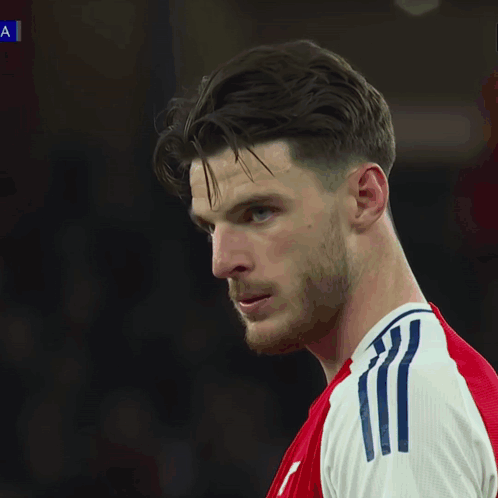 A Soccer Game Is Being Played In Front Of An Ad For Ps5 GIF