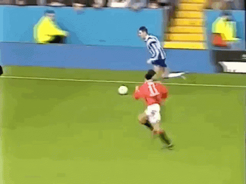 A Soccer Game Is Being Played In Front Of An Advertisement For Hicks Sport Shoes GIF