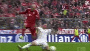 a soccer game is being played in front of an allianz ad