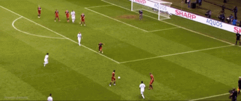 A Soccer Game Is Being Played On A Field That Is Sponsored By Sharp GIF