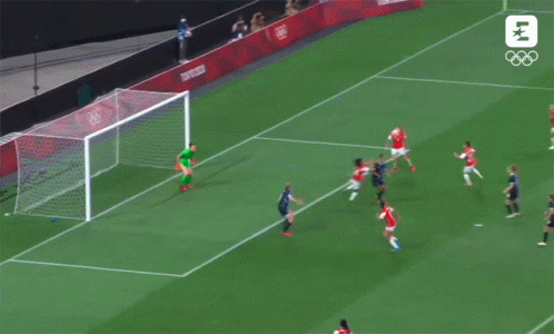 A Soccer Game Is Being Played On A Field That Says Tokyo 2020 GIF