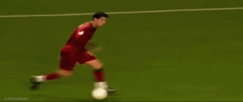 A Soccer Game Is Being Played On A Field With A Banner That Says Kmn GIF