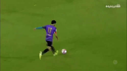 A Soccer Game Is Being Played On A Field With A Banner That Says Muradala GIF