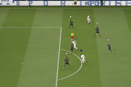 a soccer game is being played on a field with a facebook banner in the background
