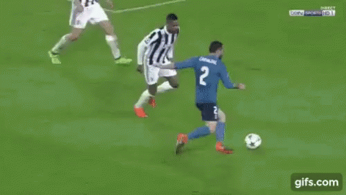 a soccer game is being played on a field with a gifs.com watermark on the bottom of the screen .